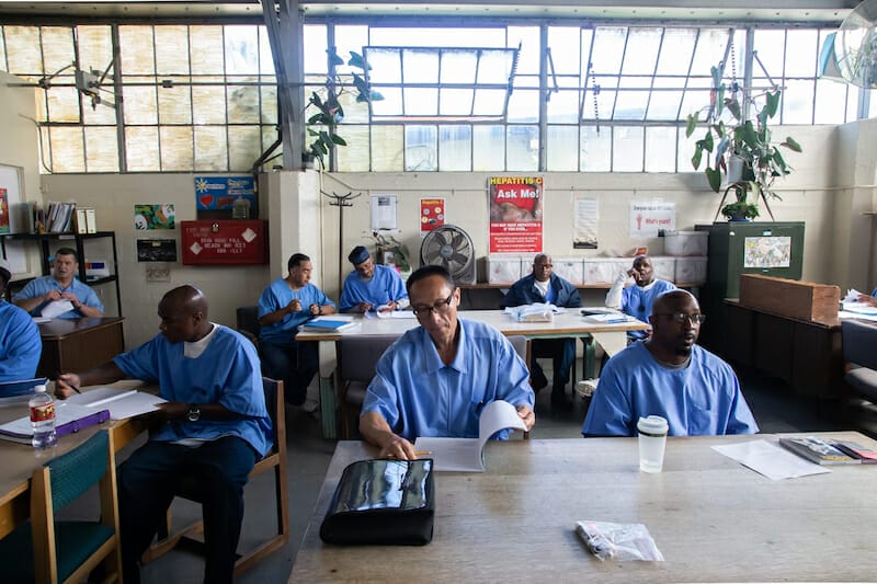 Students in San Quentin State Prison, studying at desks